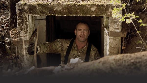 Man in bunker doorway