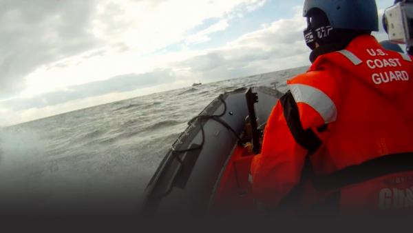 Coast Guard man in an inflatable boat