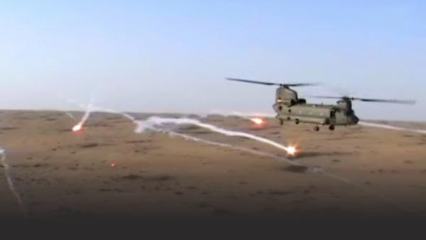 British military helicopter firing missiles in Afghanistan 