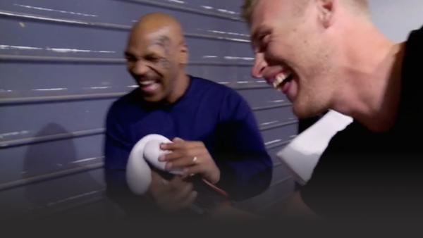 Freddie Flintoff and Mike Tyson laughing and shaking hands