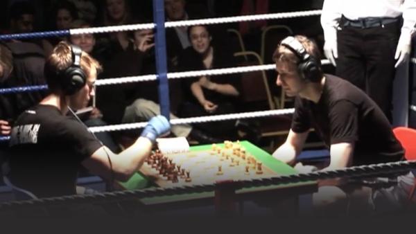 Two men competing in Chessboxing