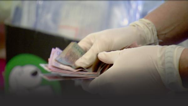 Police officer counting money