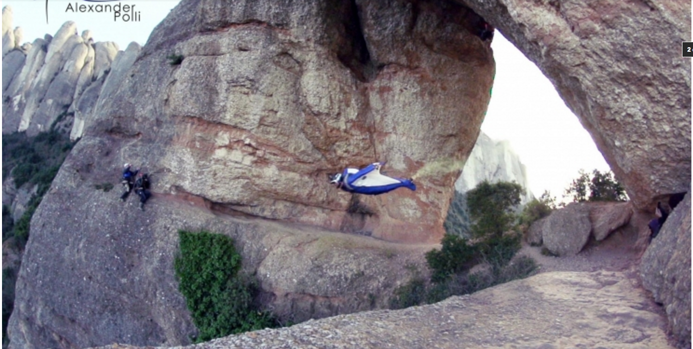Wingsuit pilot Alexander Polli's incredible cave thread Wingsuit pilot approaches a narrow cave thread