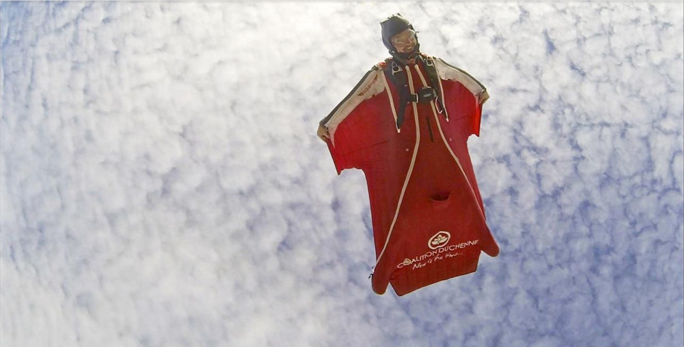 Robert S. Morgan aka Scotty Bob, makes a French Alps Proximity Flight Wingsuit pilot flying high and grinning