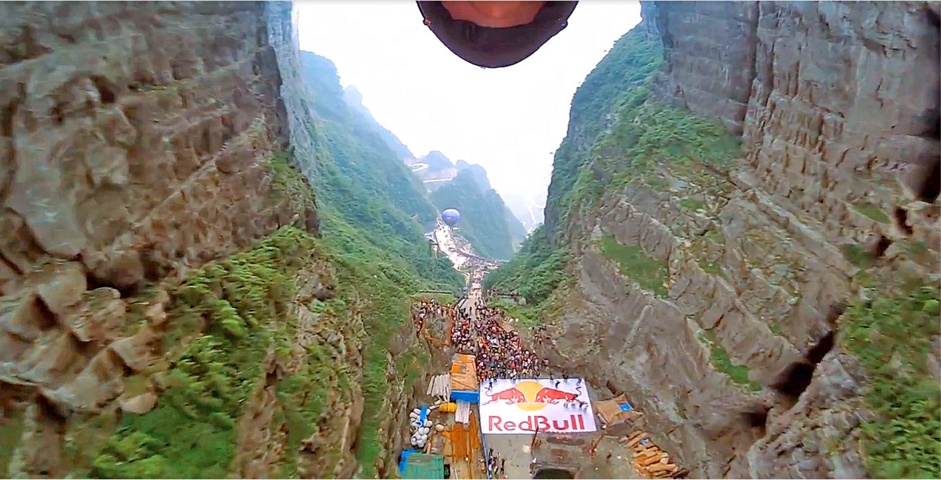 Wingsuit pilot Jeb Corliss flies through Heaven's Gate in Tianmen Mountains, China Wingsuiter flies through a canyon