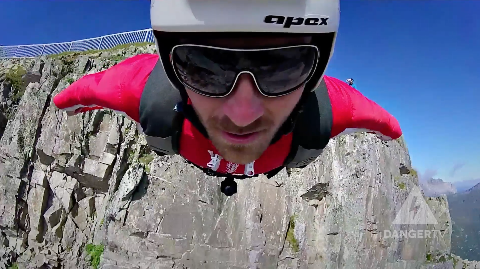 Wingsuit flying in the Alps Man in wingsuit