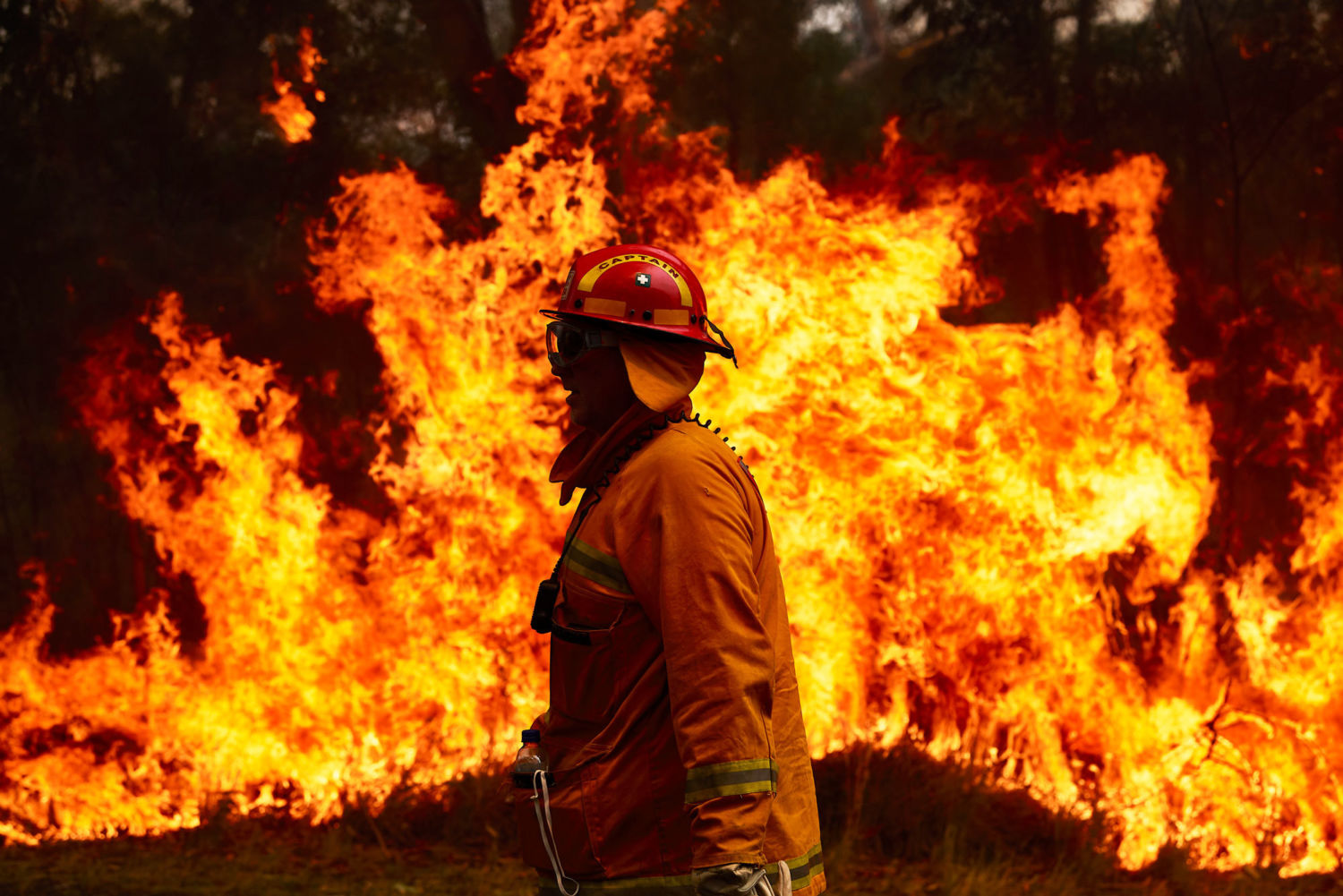 Black Saturday Brushfires Australia Fireman in front of fire