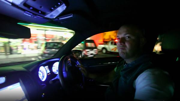 Man in a car at night