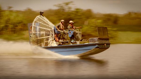 Two men on an airboat
