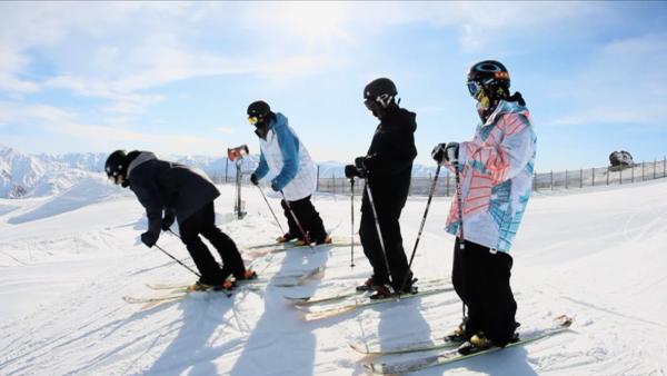 Four men skiing