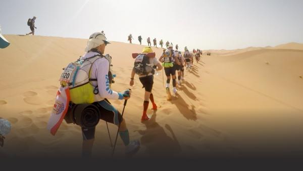 Racers walking in desert