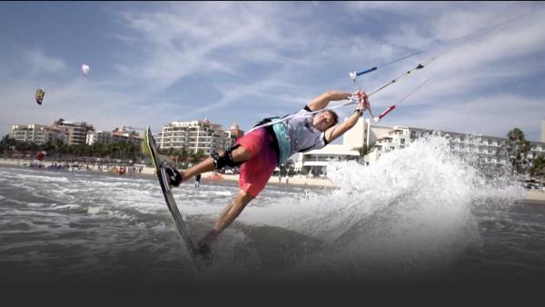 A man kitesurfing