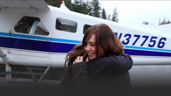 Two women hug