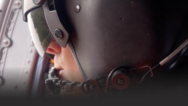 Close up of man in helicopter