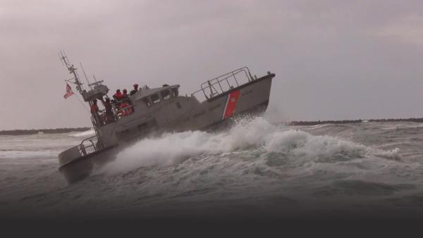 Coast Guard cutter on huge wave