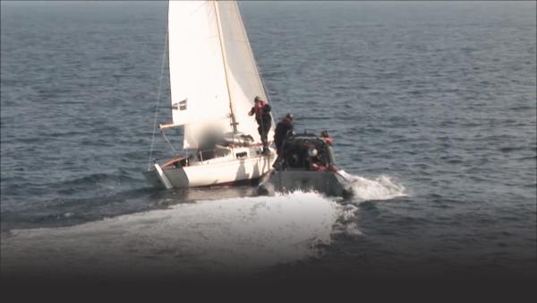 Customs gets on board of a boat to search for drugs. 