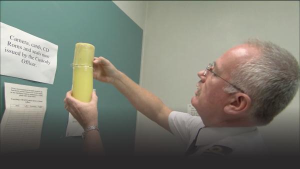Custom officer finds candles with cannabis inside. 