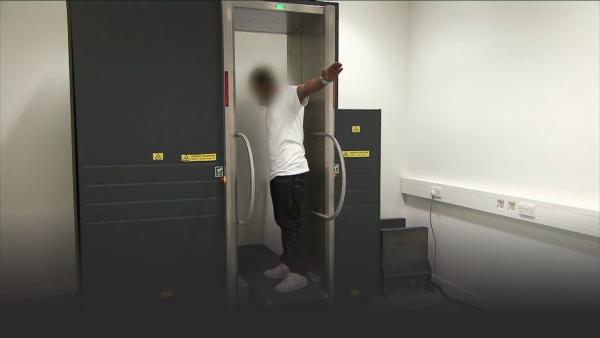 A full body scan to see if the man is smuggling drugs