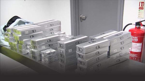 Passengers caught smuggling cigarettes. 