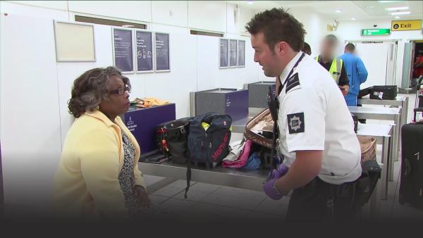 Customs officer and passenger