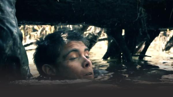 Man fighting to keeping his head above the water 
