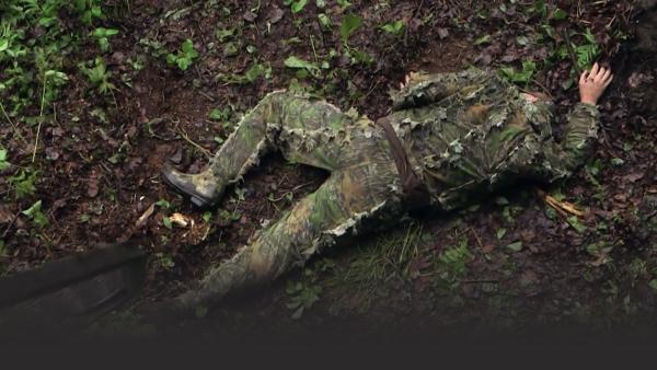 man in camouflage on floor