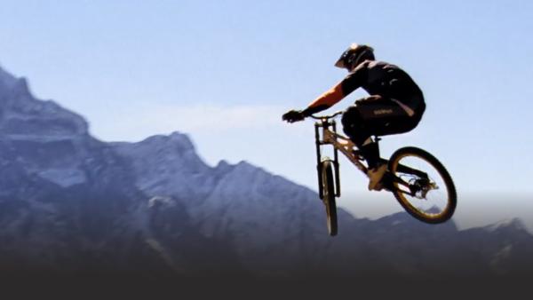 Someone biking down a mountain. 