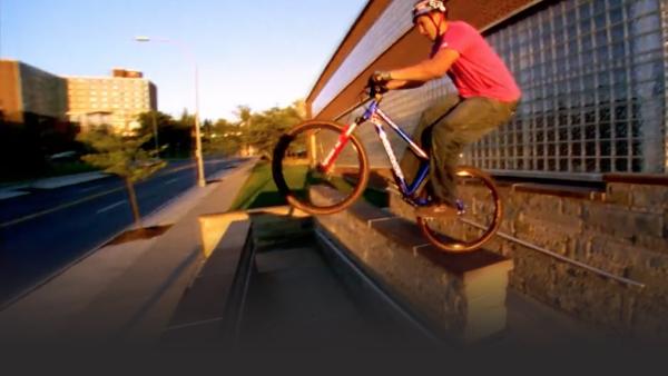 Aaron balancing on the edge of some railings. 