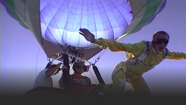 Skydiver jumping out of a balloon