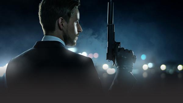 Spy with gun with silencer