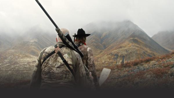 Men walking with guns