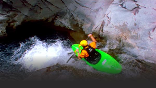 Man in a kayak on river