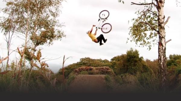 Man motocross flipping off a jump 