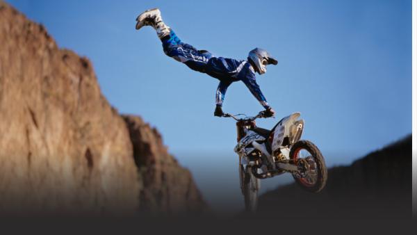 Trey Dean with both legs in the air.