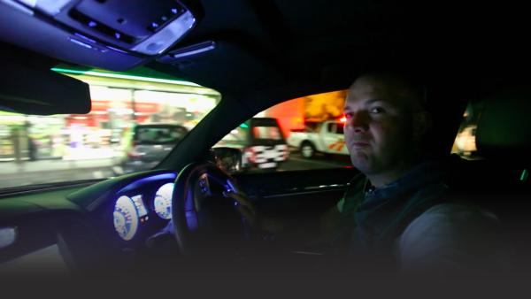 Man in a car at night