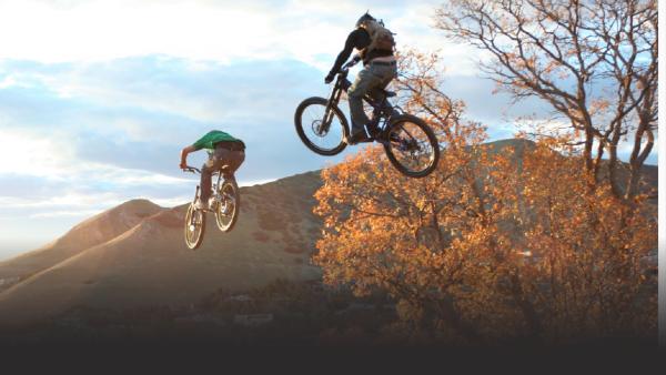 Chris and Nick Van Dien mountain bike racing. 