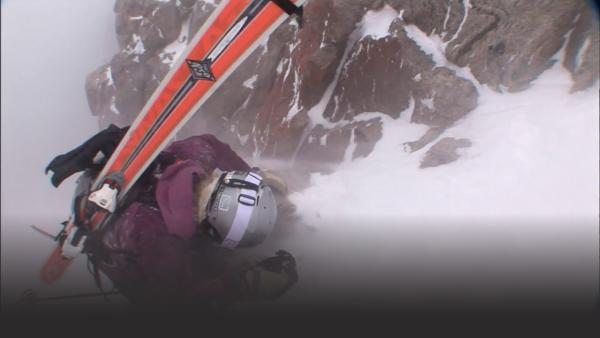 One women faces a challenge as she trips trying to reach the top.
