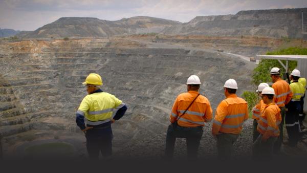 Workmen survey a mine