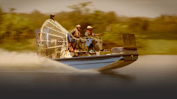 Two men on an airboat