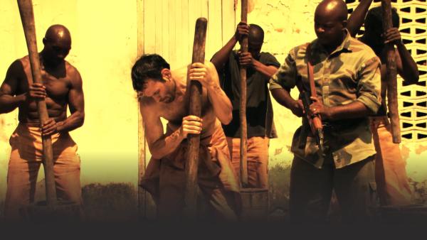 Man working in Gambian prison camp