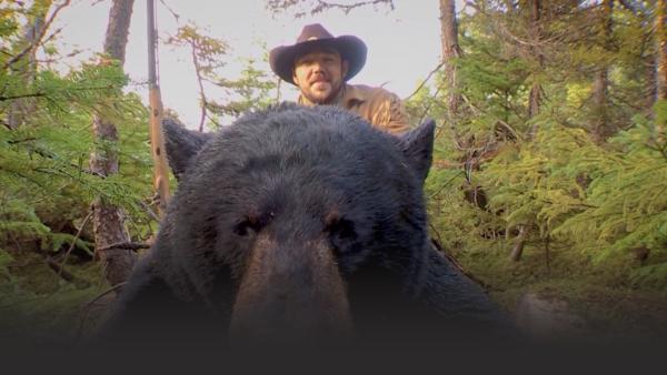 Man posing with bear