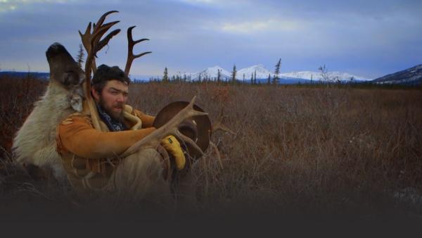 Man with an elk on his back