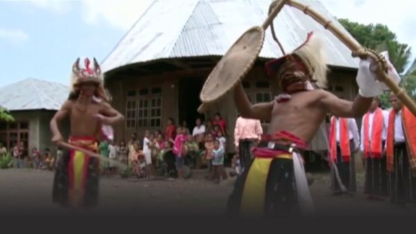 Two men competing an ancient war training exercise: whip fighting