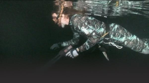 Swimming with gear.